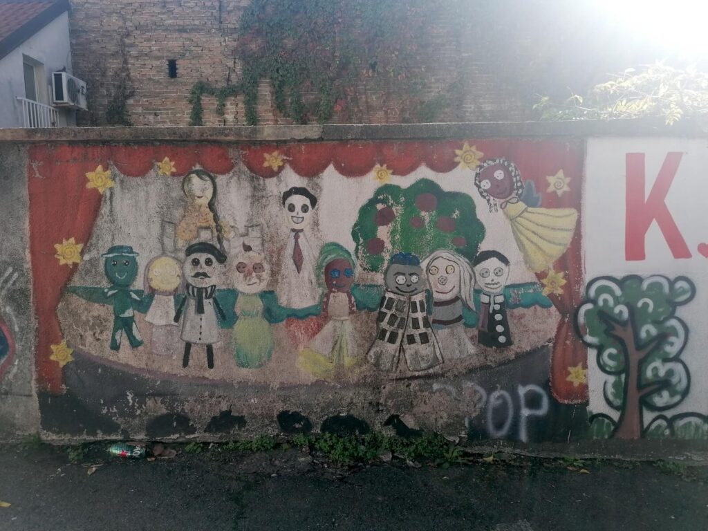 Photo: a mural depicting happy children at play